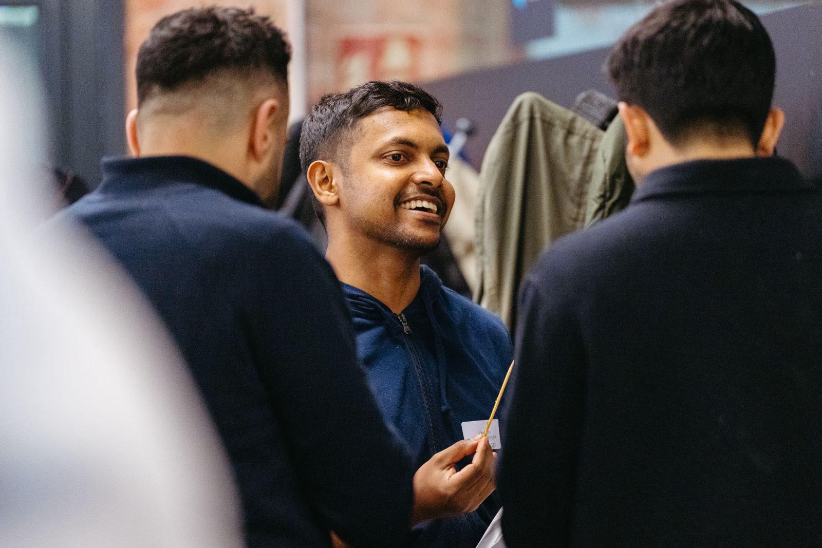 Vimukthi Wickramasinghe smiling in a conversation